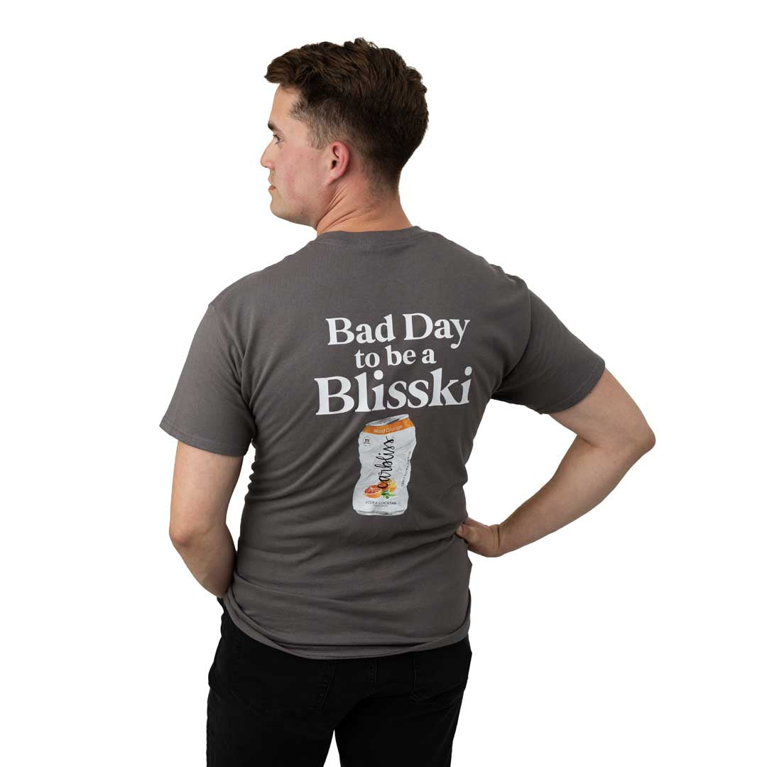 Man wearing a gray t-shirt with 'Bad Day to be a Blisski' text and graphic on the back.
