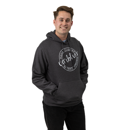 Man wearing a dark gray hoodie with text on a white background