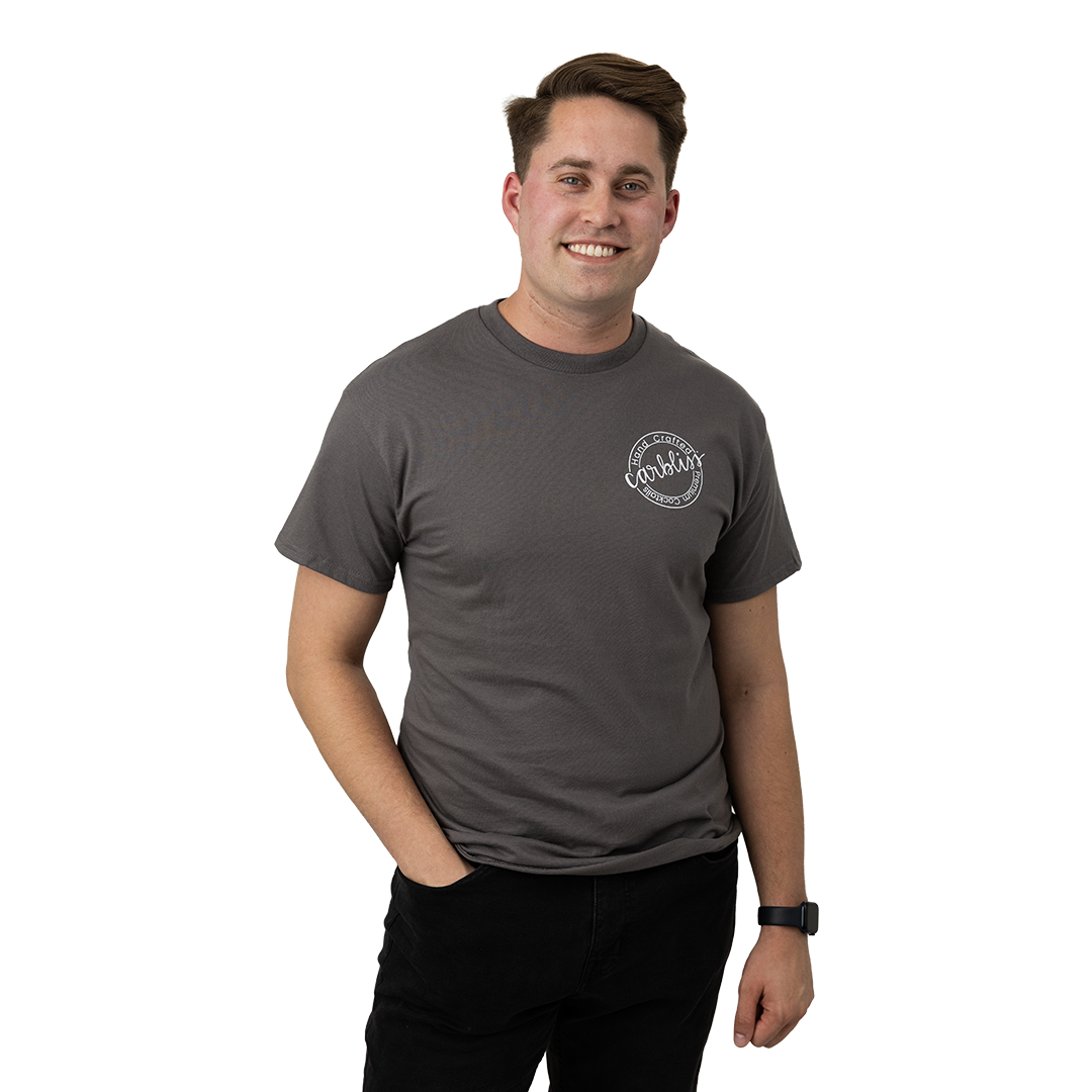 Man wearing a gray t-shirt with a logo on a white background