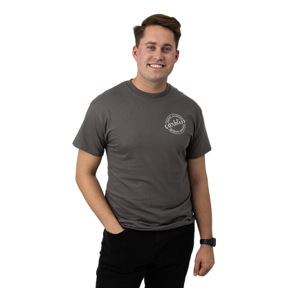 Man wearing a gray t-shirt with a logo on a white background